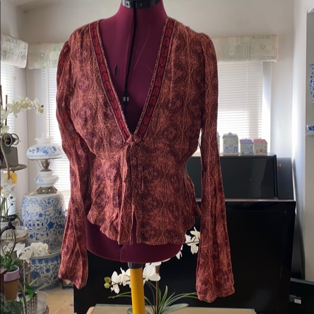 Brown printed top, free people with a tag. New
